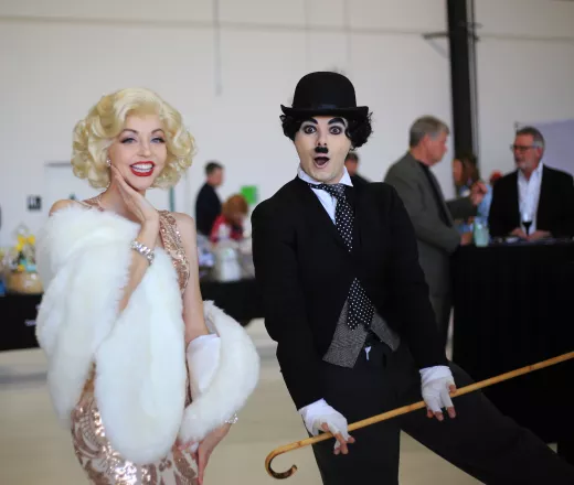 A couple dressed as Marylin Monroe and Charlie Chaplin.